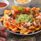 Kettle Chip Nachos Topped With Steak, Blue Cheese, and Pickled Shallots