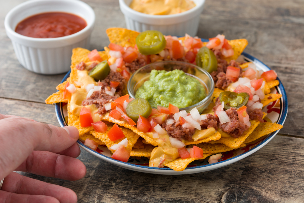 Kettle Chip Nachos Topped With Steak, Blue Cheese, and Pickled Shallots